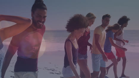 animation of lens flares over diverse young friends walking at beach during sunny day
