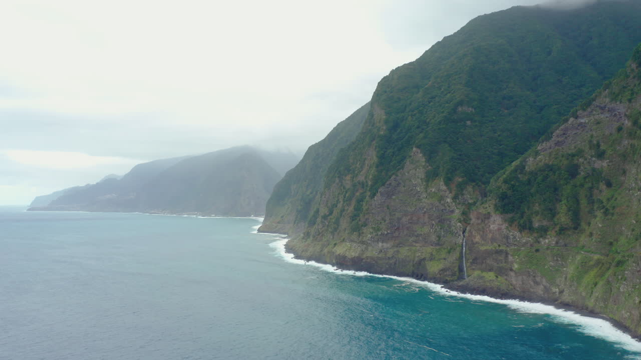 Coast line Miradouro do V&eacute;u da Noiva waterfall madeira drone shot mountain with waves Panorama Sky ocean, beach