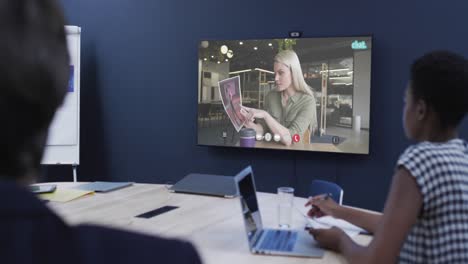 diverse business people on video call with caucasian female colleague on screen