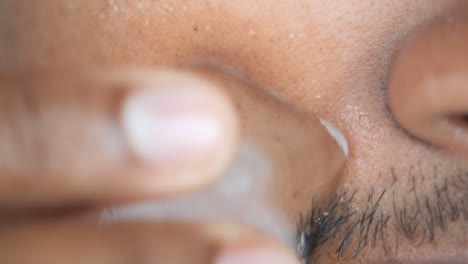 applying eye cream