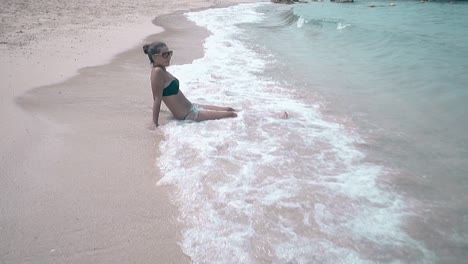 rolling-ocean-waves-with-white-thick-foam-cover-woman-body