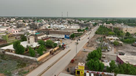 serene main road in badin, pakistan. aerial flyover