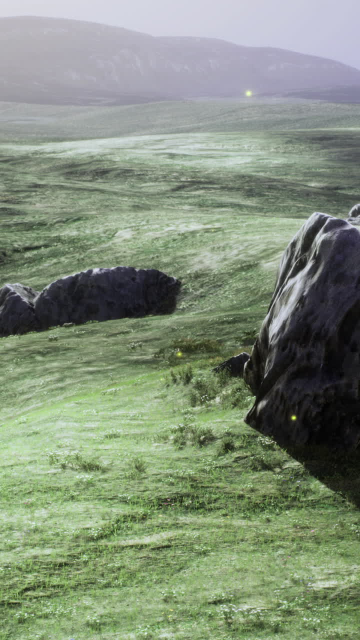 Expansive green landscape with rocky formations under a twilight sky