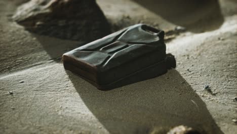 old rusty fuel canister in the desert