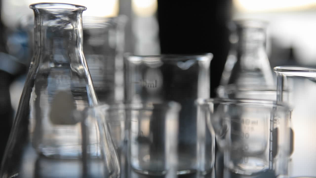 Laboratory glass ware sits on top of a labs counter
