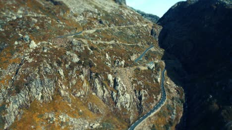 an aerial view of the narrow mountain road snaking through the plateau