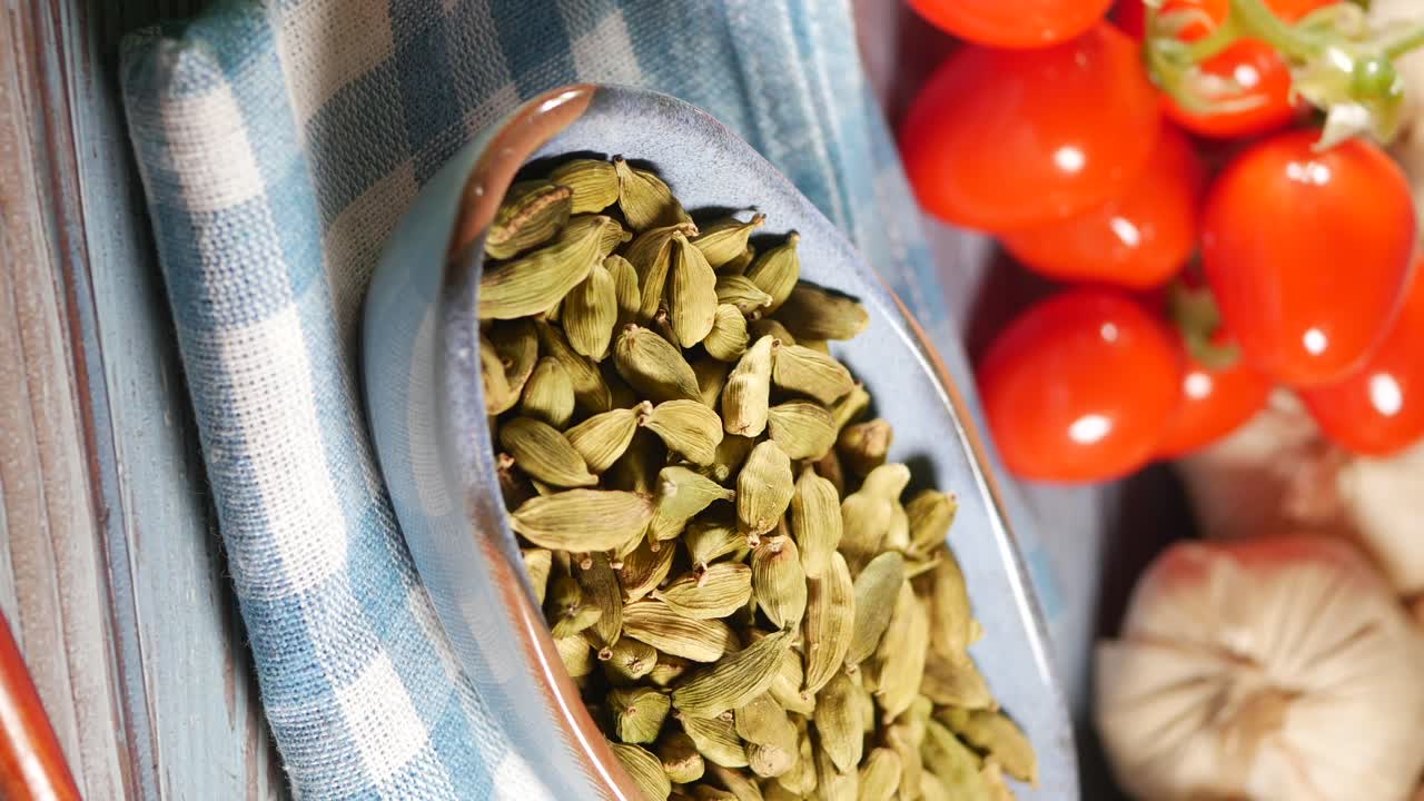 Green Cardamom Pods in a Bowl with Vegetables