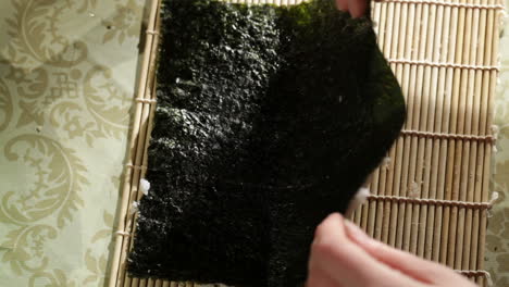 Putting-rice-on-nori-High-angle-view