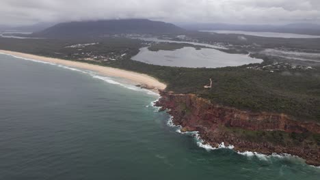 Dunbogan Beach, Gogleys Lagoon And KATTANG Nature Reserve On A Cloudy Day In NSW, Australia. - aerial shot
