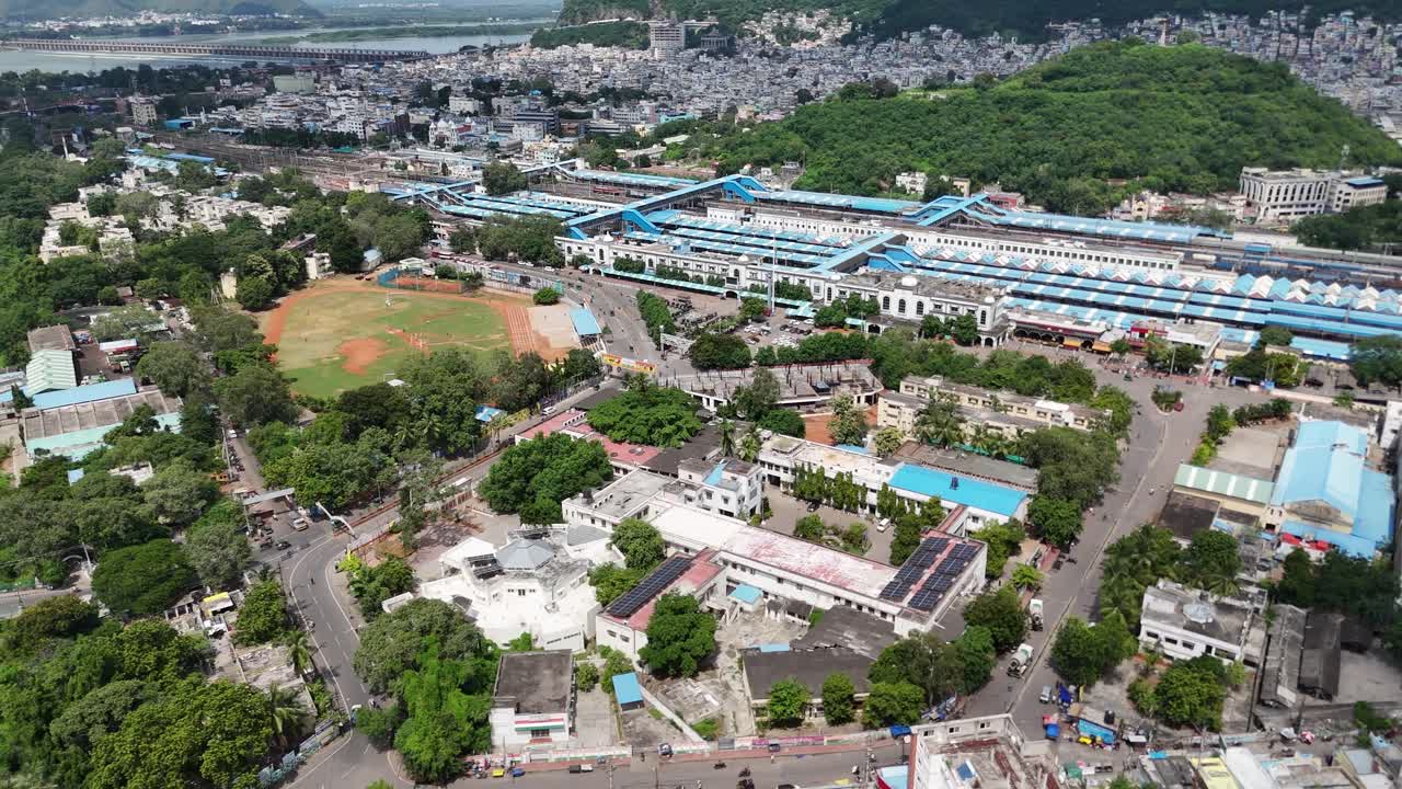 Aerial View of a City with a Large Train Station and River