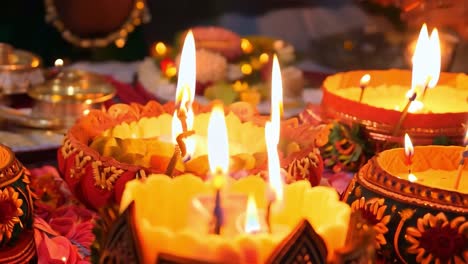 close-up of burning candles during a hindu ceremony