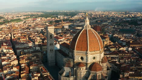 aerial orbit shot of florence cathedral at sunrise