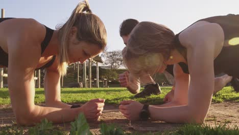 Young-women-training-at-an-outdoor-gym-bootcamp