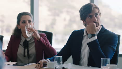 corporate business people brainstorming in boardroom meeting discussing strategy colleagues sharing ideas working on deadline collaborating in office 4k