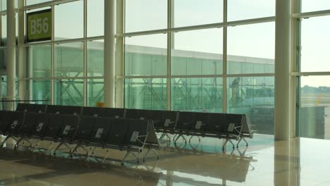 Lonely-and-empty-airport-terminal-and-seats-with-no-tourists-during-Covid-19-pandemic