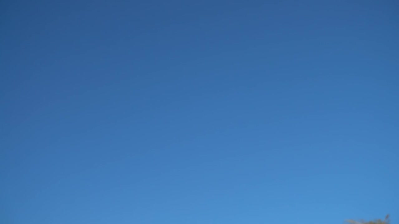 Soap bubbles against the background of the sky. Slow motion