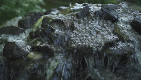 close up of rock waterfall flowing water