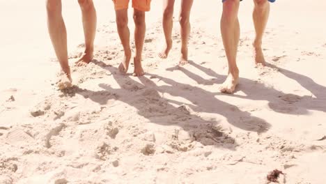 Family-walking-on-the-beach