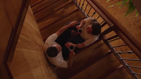 couple at home together on the stairs