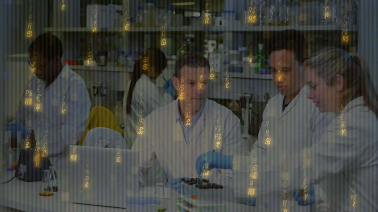 Scientists reviewing results on lab laptop, passing sample and adding reagent for analysis