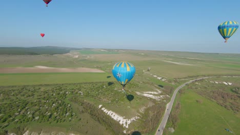 hot air balloons over a beautiful landscape