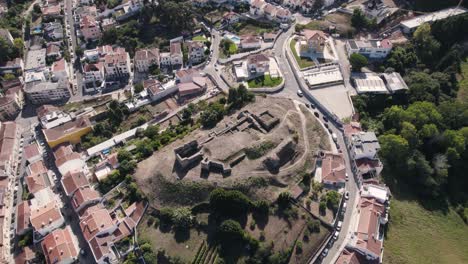 Ruins-of-the-Castle-of-Alcobaça-located-on-a-hill-overlooking-the-city,-Portugal