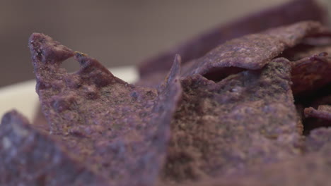 delicious close up on a bunch of crispy, crunchy, blue nachos