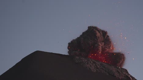 Fuego-Volcano-erupts,-spewing-glowing-lava-into-the-sky