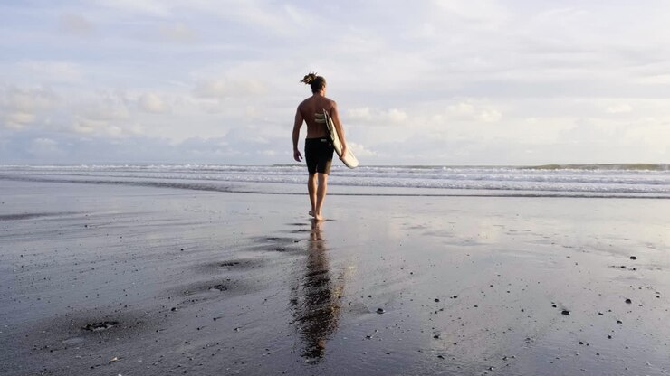 Young man with surfboards