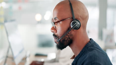 man in a call center talking on a headset