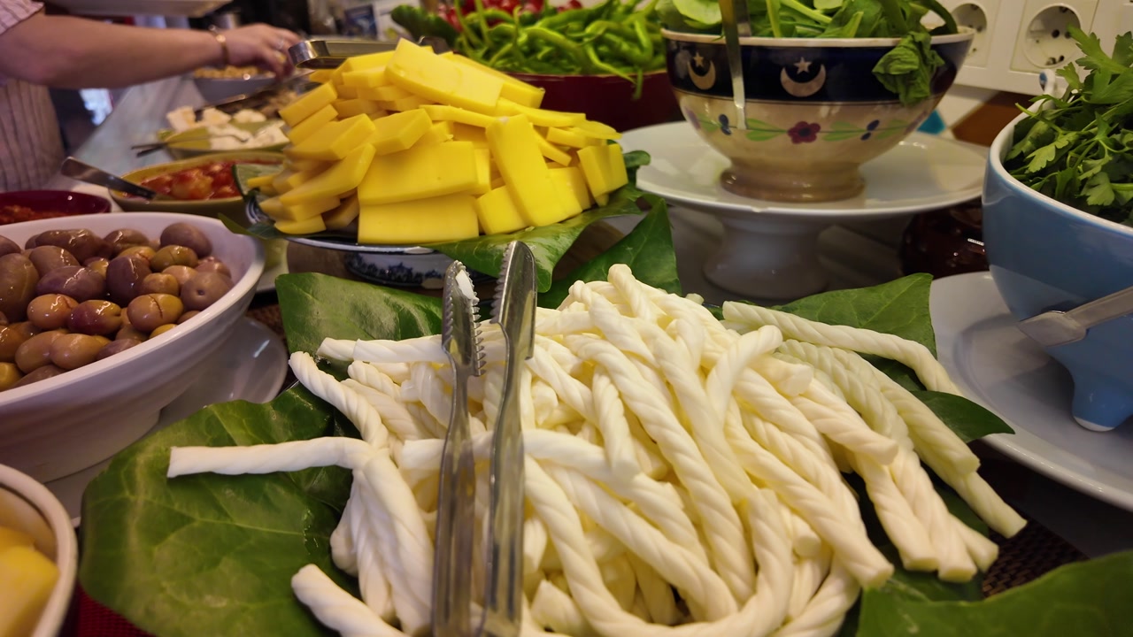 Delicious Breakfast Buffet with Assorted Cheeses and Greens