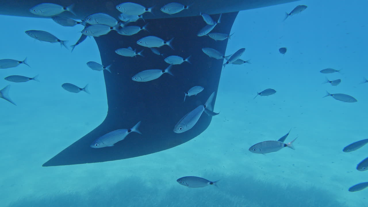 underwater view looking up to a yacht in lefkada, greece