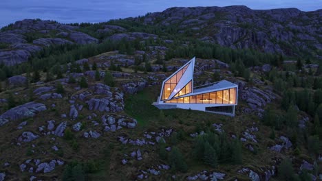 modern mountain house at dusk