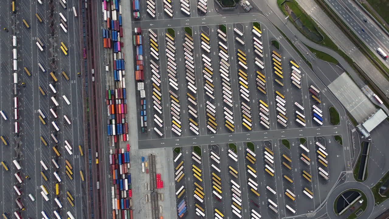 Aerial View of a Busy Truck Parking Lot and Cargo Terminal