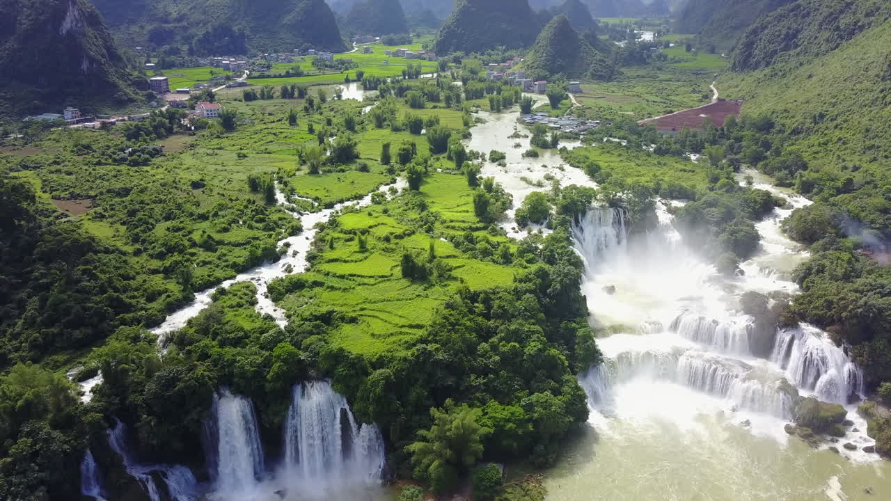 Serene aerial view of Ban Gioc Waterfalls and lush green landscape