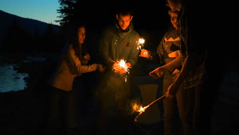 group of hikers lighting sparkler 4k