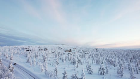 drone flies towards small village in arctic lapland finland