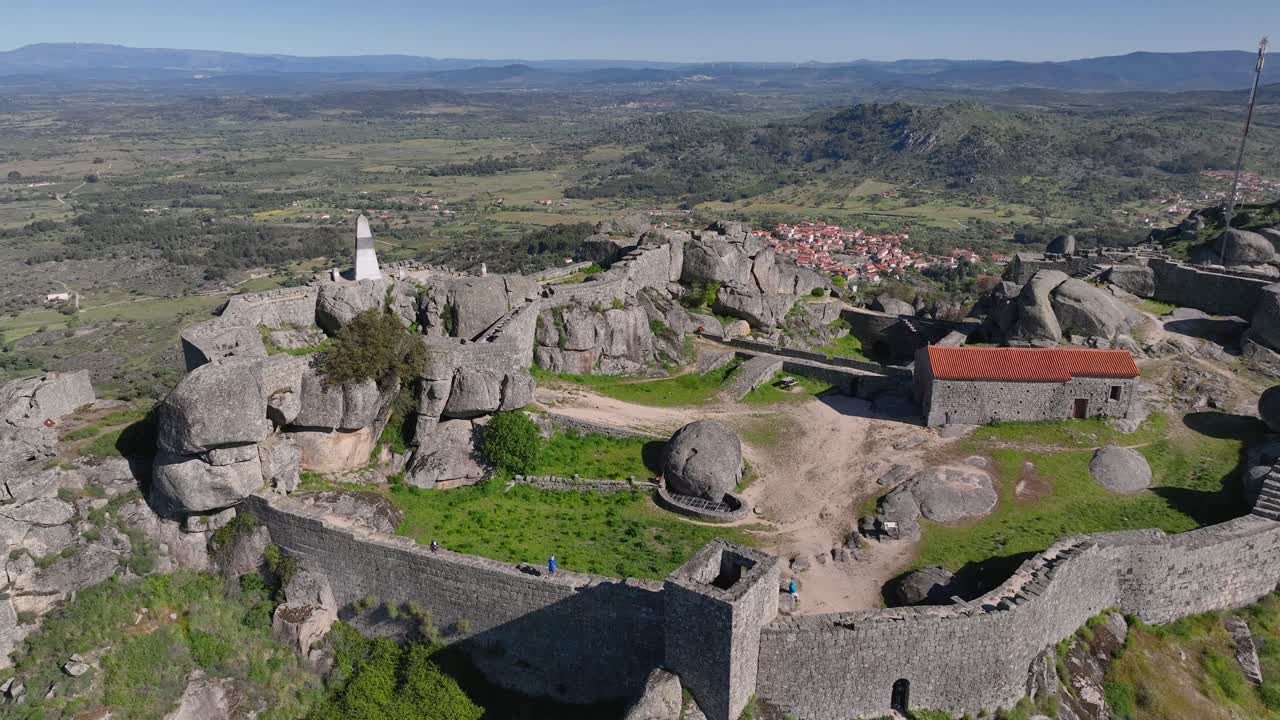 Monsanto, "the most Portuguese village," blends homes with granite boulders. Its hilltop castle offers stunning views. Rich in history, rustic charm, and traditions.