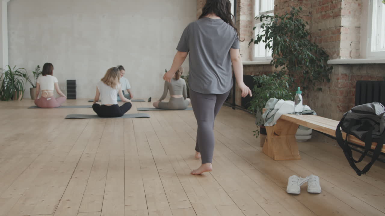 Young Woman With Down Syndrome Practicing Group Yoga Classes