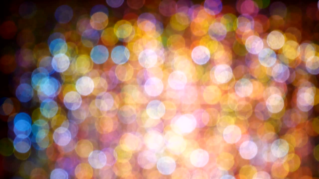 un bucle de video de 4k de fondo bokeh abstractamente colorido desde la luz.