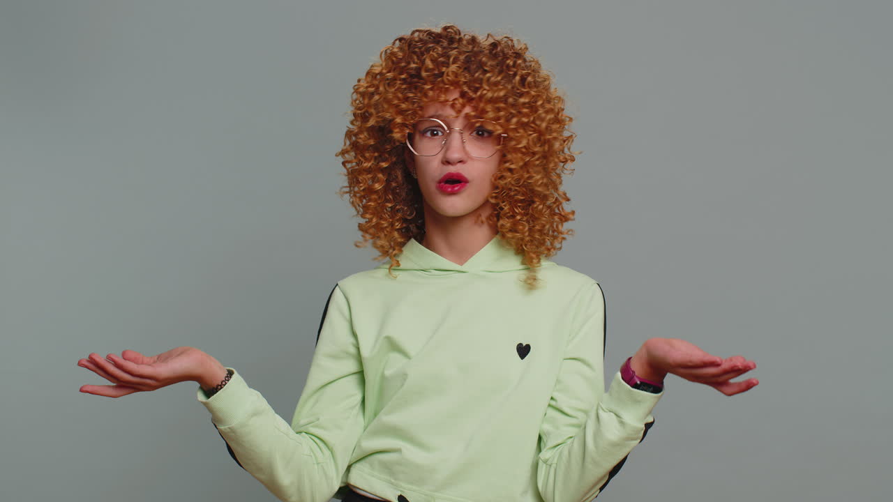 Confused young teen girl child feeling embarrassed having doubts no idea being clueless uncertain