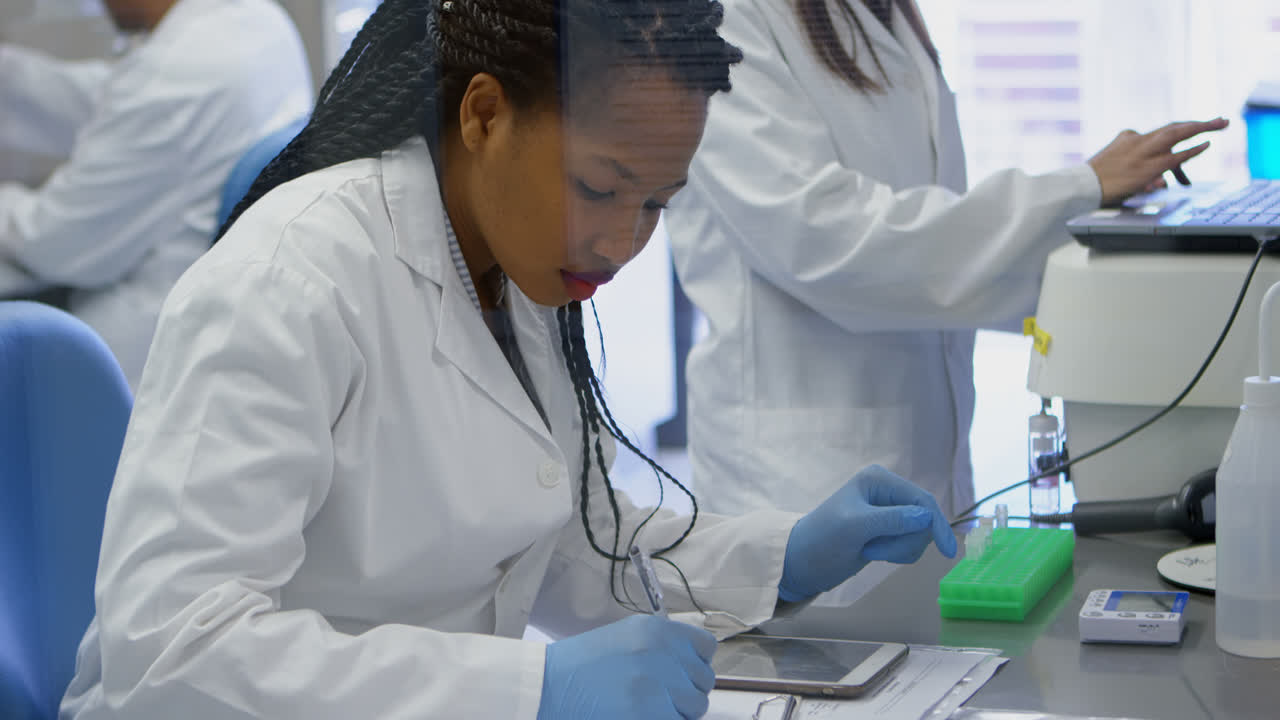 Scientist using digital tablet 4k