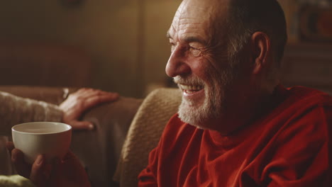 elderly man relaxing with a drink