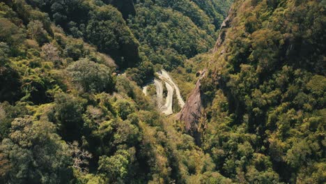 beautiful rainforest tropical mountain road tio down aerial establishing shot, serra do corvo branco, grão pará, santa catarina, brazil