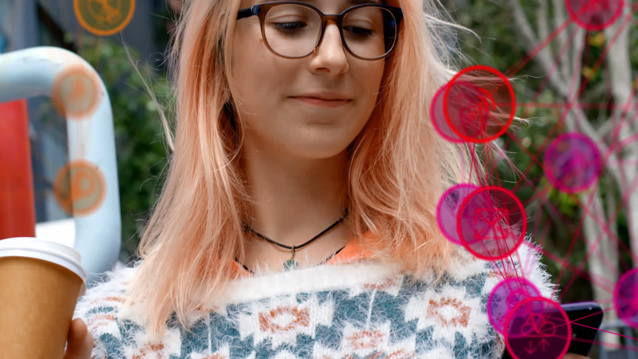 Animation of digital icons over woman using smartphone