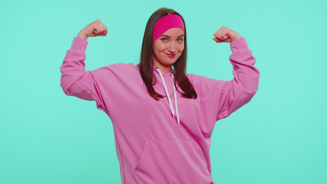 Girl showing biceps feeling power strength to fight for rights energy to gain success win fight