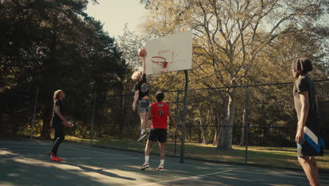 young men playing basketball