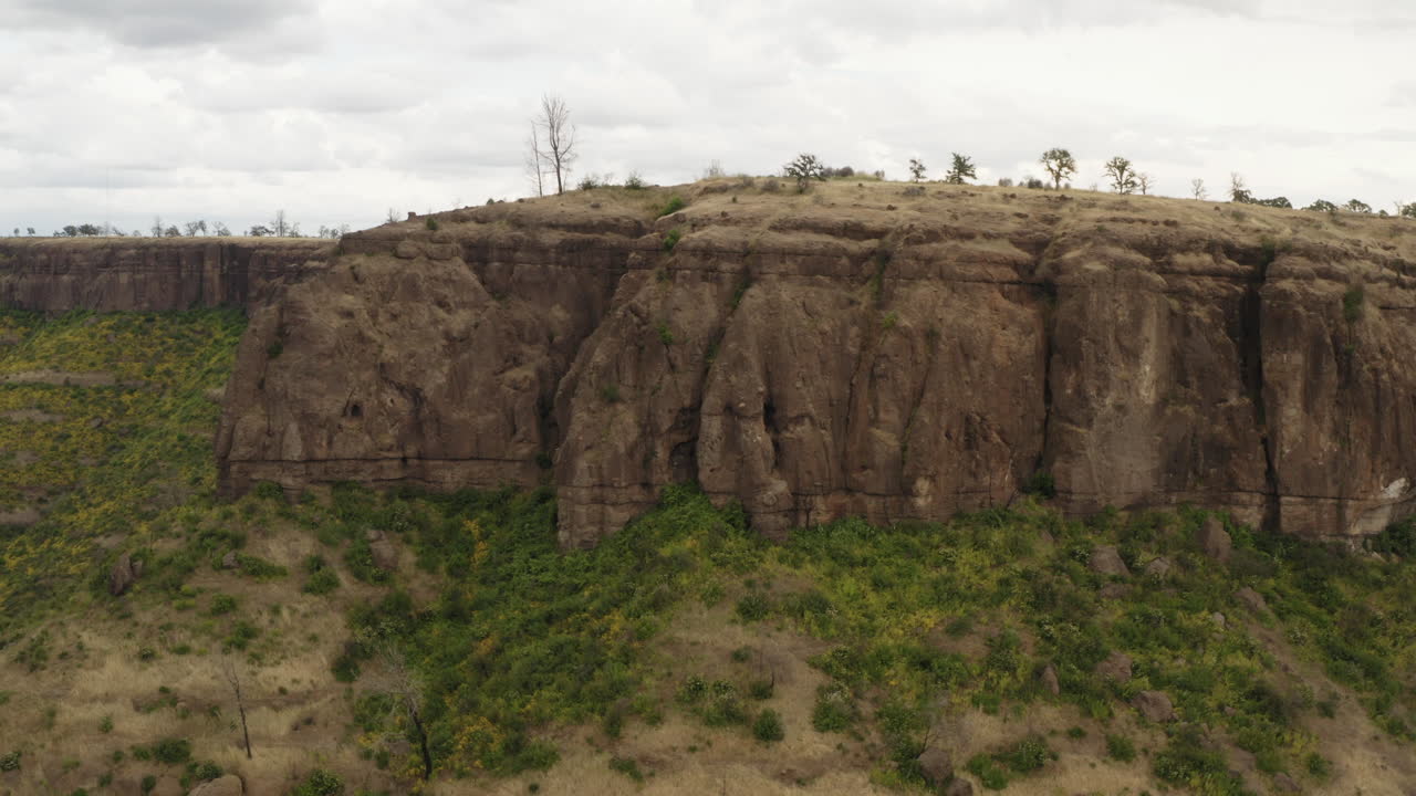 Butte Creek lookout over California mountain ridge plateau, aerial sliding view