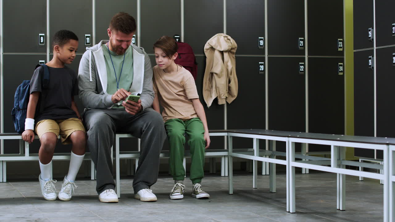 Man and children at the locker room