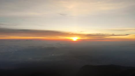 scenic view from atop of la malinche mountain overlooking the landscape with a sunset on the horizon in mexico